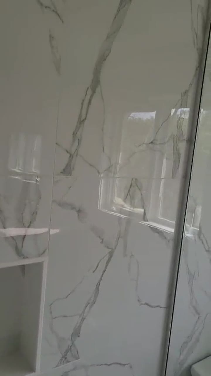 Calacatta marble walk-in shower — finished master bathroom by Blue Tile & Marble